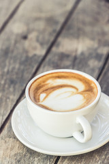 Hot coffee cup on wood table decorative,Working and meeting concept,Selective focus on coffee cup,Vintage color tone.