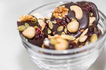 Chocolate cookies with dried fruits and nuts in a bowl.
