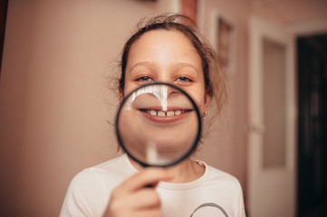 picture of woman with magnifying glass showing teeth