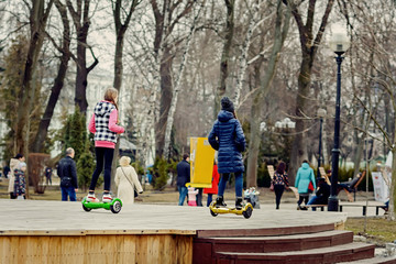 Two girls on electric gyroboards