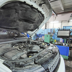 Fototapeta premium Moscow, Russia - August, 26, 2016: Car with open hood in a repair station in Moscow, Russia
