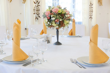 Interior of a cafe with the serviced tables