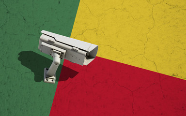 Benin flag on wall with CCTV surveillance security camera