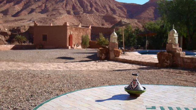Sunny view from the terrace of a riad, next to a swimming pool in Ouarzazate, Morocco