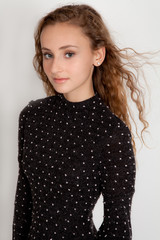 Pretty Teen With Blowing Hair in Polka Dot Dress