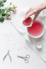 salt and cream for nail care in spa top view