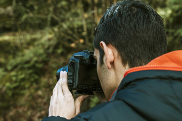 young man with the camera outdoors