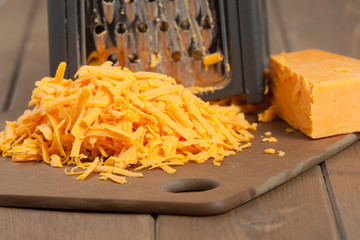 Grated Red Leicester Cheese. Grater. Cooking Ingredient.