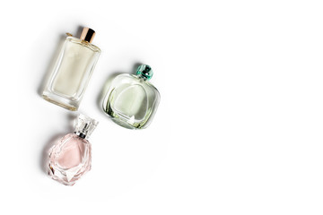 Perfume bottles on light background. Perfumery, cosmetics, fragrance collection. Free space for...