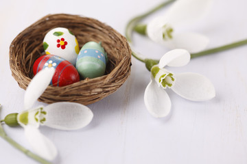 Easter eggs in a nest with flower