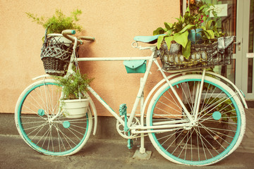 Naklejka na ściany i meble Decorative bicycle with flowers