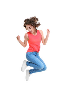 Joyful young woman jumping on white background