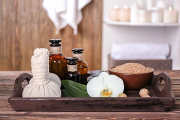 Spa treatments on wooden tray