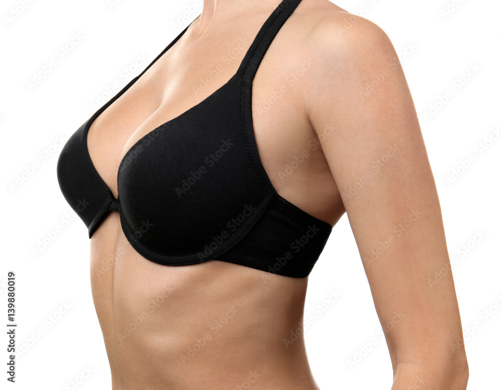 Wall mural Plastic surgery concept. Closeup view of woman in black bra