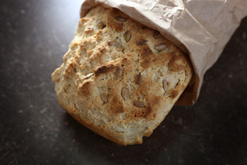 Tasty loaf of beer bread on table