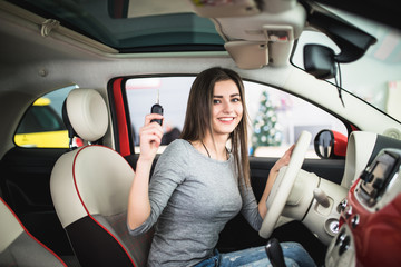 woman in the car with the keys in the hands