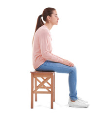 Posture concept. Young woman sitting on chair against white background