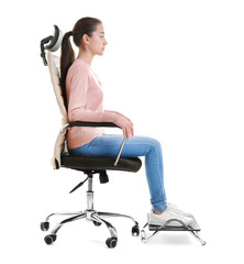 Posture concept. Young woman sitting in armchair against white background