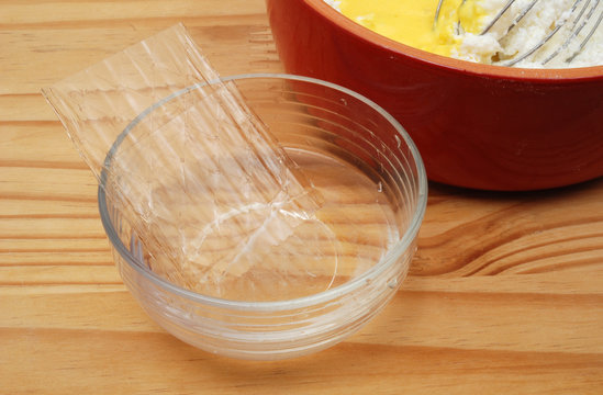 Stacked leaves of jelly in glass bowl.