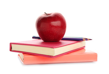 Red apple, pencils and books on white background
