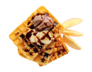 Tasty waffles with delicious fruit, ice-cream and syrup on white background