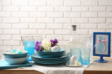 Beautiful Easter table setting with blue plates