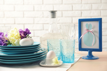 Beautiful Easter table setting with blue plates
