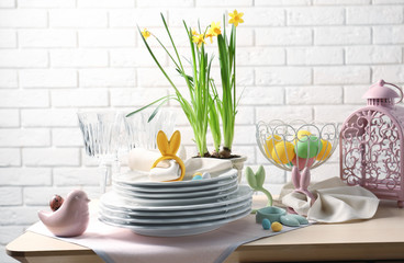 Beautiful Easter table setting with white plates