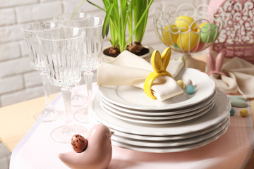 Beautiful Easter table setting with white plates