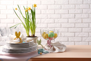 Beautiful Easter table setting with white plates
