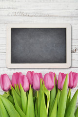 Pink tulips with chalkboard