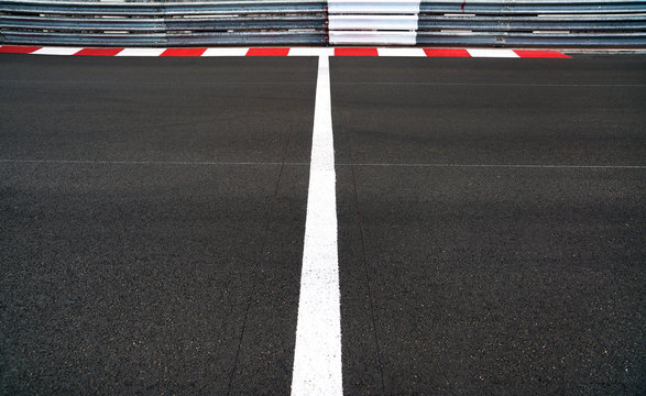 Start and Finish line in motor race asphalt Grand Prix track and guard rail or guardrail
