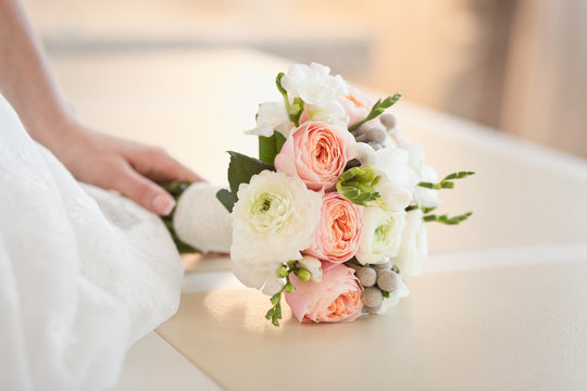 Tender bouquet of roses in Bride's hands