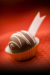 Romantic Valentine's Day Chocolate Truffle on Red