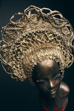 Mannequin in golden head wear