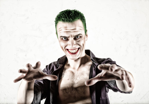 guy with crazy clown face, green hair