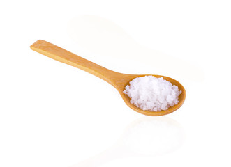 Teaspoon salt on white background