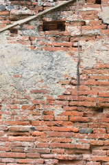 Weathered stained old brick wall background