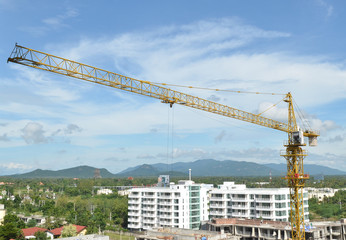 Fototapeta na wymiar Crane and building working progress