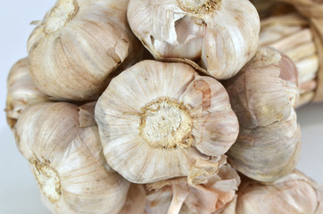 Garlics on a wooden table with a selective focus