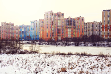 New buildings on the river in winter
