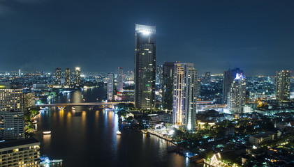 Fototapeta na wymiar Skyscraper Bangkok downtown top View at Night from top of Thailand