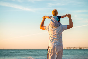 Father and son piggyback © myphotobank.com.au