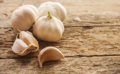 Composition of garlic on wooden background, close up