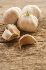 Composition of garlic on wooden background, close up