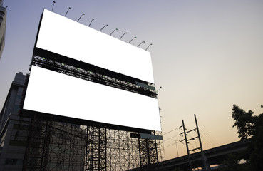 Blank billboard at twilight time ready for new advertisement.