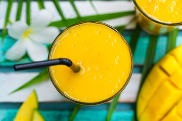 Fresh tropical fruit smoothie mango juice Top view