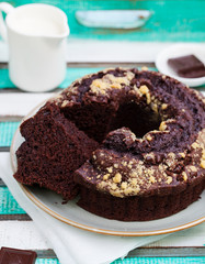 Chocolat bundt cake. Colorful wooden background.