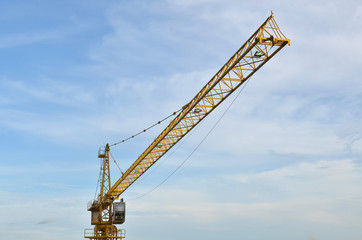 Fototapeta na wymiar Crane and building working progress, construction site