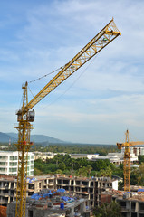 Crane and building working progress, construction site